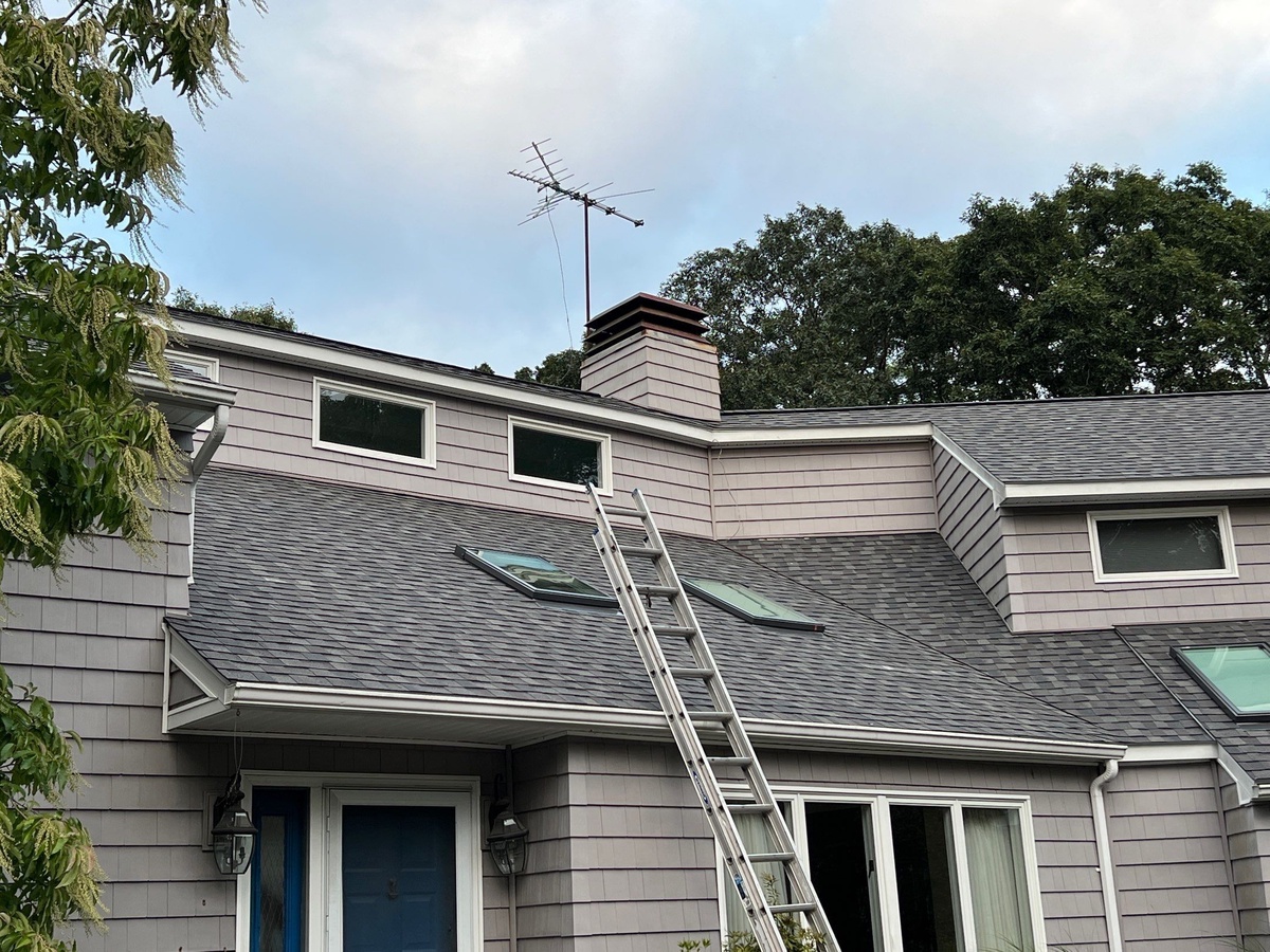 A Complete Exterior Renovation in South Kingstown, RI — NorthGate Driftwood Roof, VELUX Skylights, Siding and Gutters