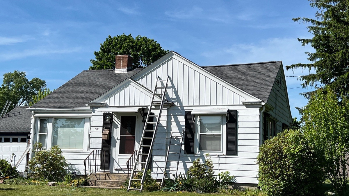 Ladder work during Warwick RI wind damage roof replacement