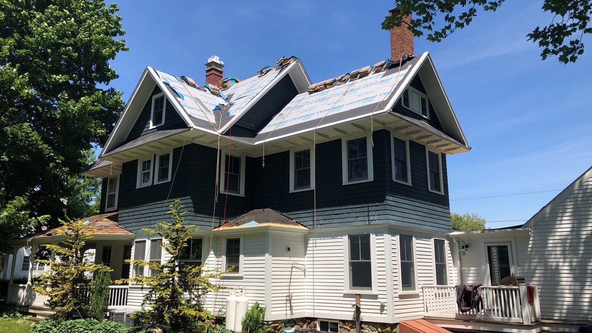 Original spaced board sheathing exposed during North Kingstown roof replacement