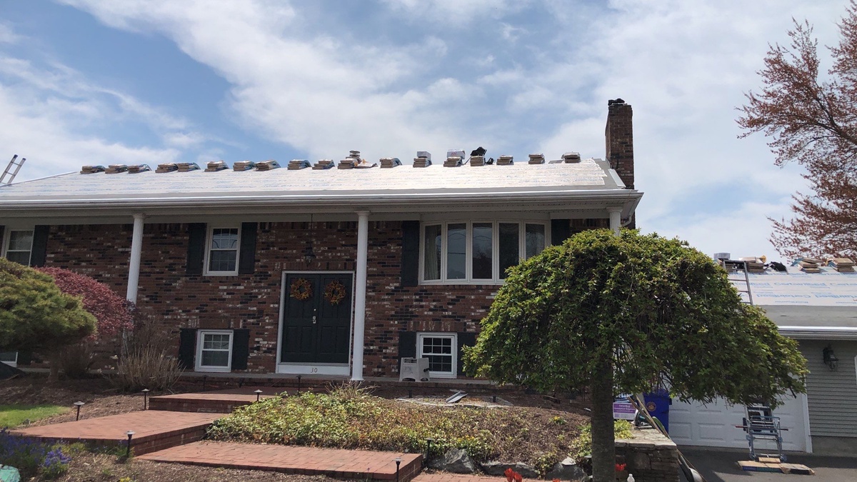 Roof replacement in progress North Providence RI ranch