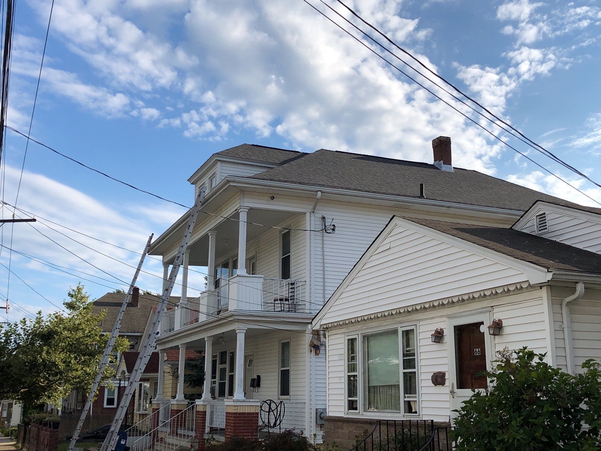 New Landmark roof from street Providence RI wind damage replacement