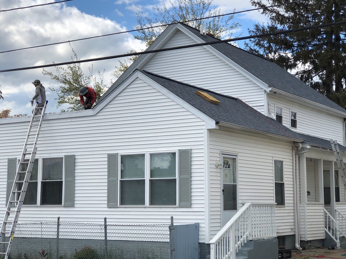 Two Roofs in One — OC Duration Harbor Blue and a Mule-Hide Low-Slope System After Storm Damage in Providence, RI