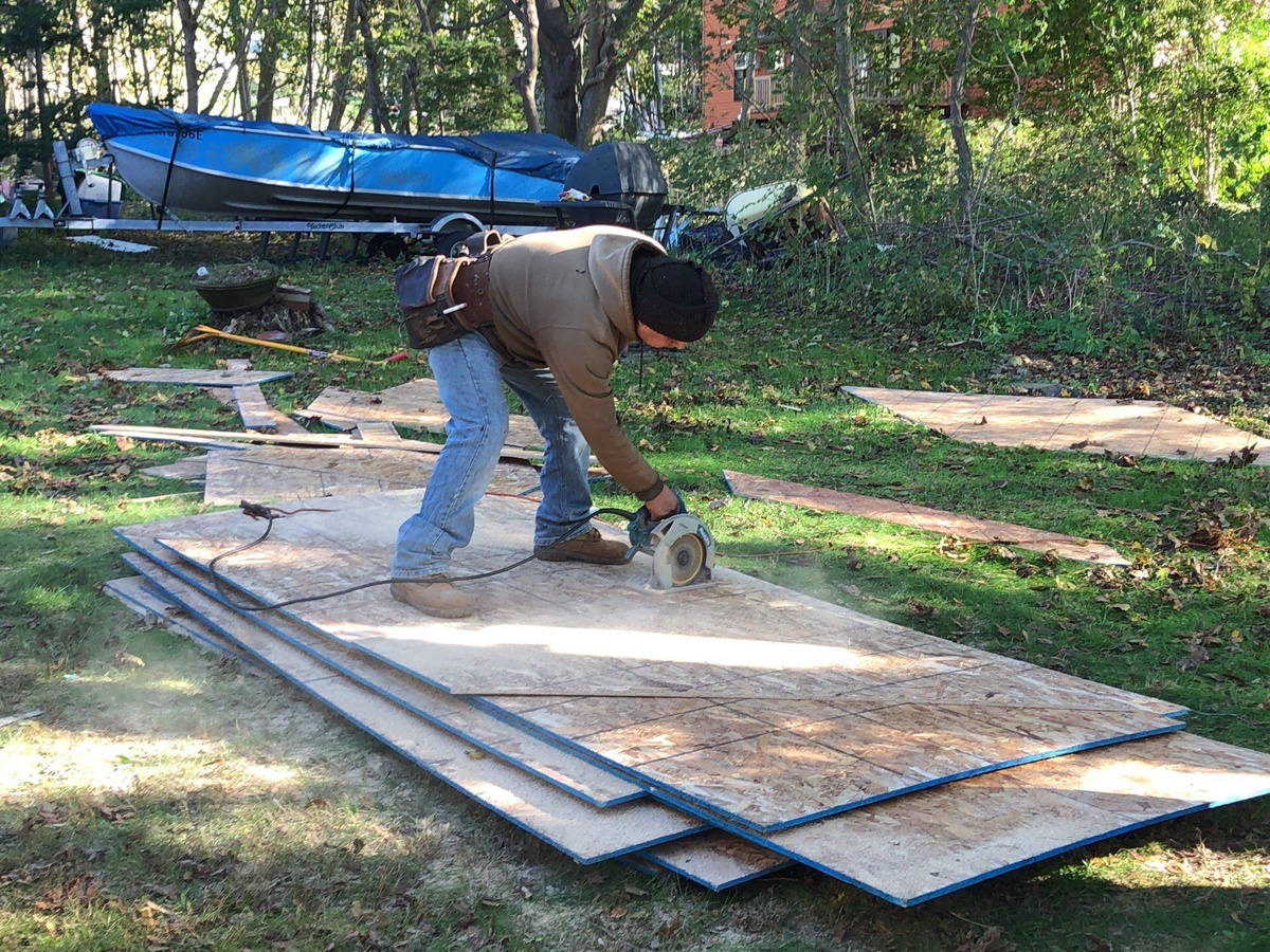 New plywood roof decking being cut for Jamestown RI roof replacement