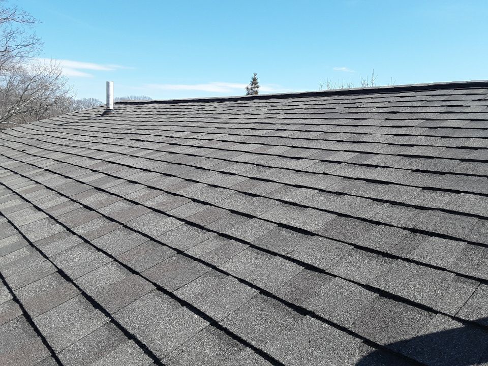 Weathered Wood shingle field close-up Johnston RI storm restoration