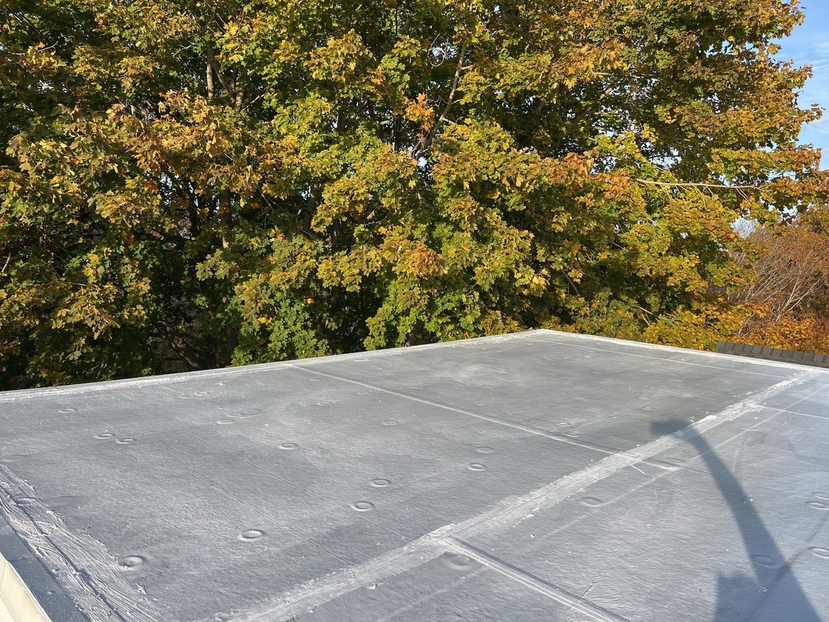Westerly, RI Roof Repair: CertainTeed NorthGate Moire Black Shingles Over a Silicone-Restored Low-Slope Section