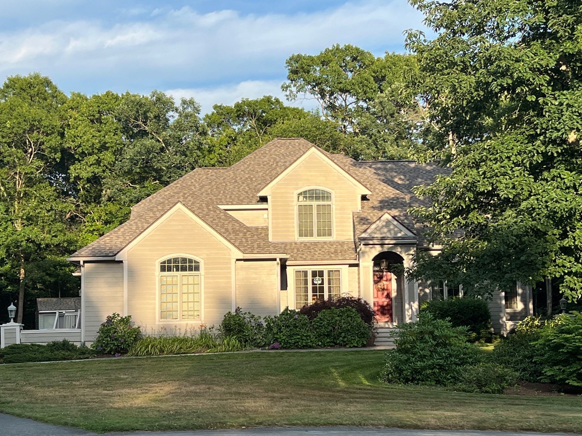 Weathered Wood roof in evening light Class 4 impact resistant shingles Tiverton RI