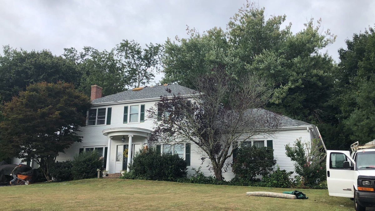 After — Wind-Storm Insurance Claim in North Kingstown, RI — Landmark PRO in Colonial Slate Plus VELUX Skylights