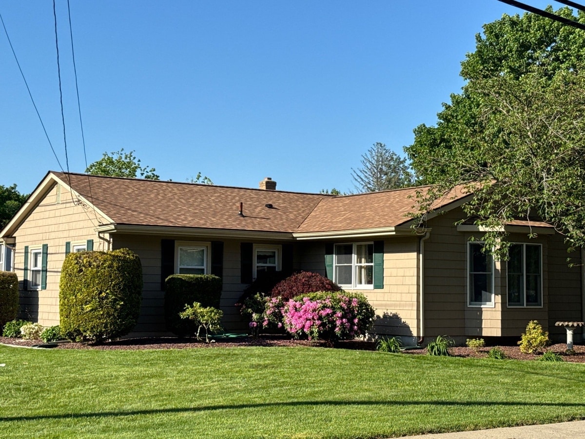 Landmark Resawn Shake roof over Coventry ranch, spring blooms