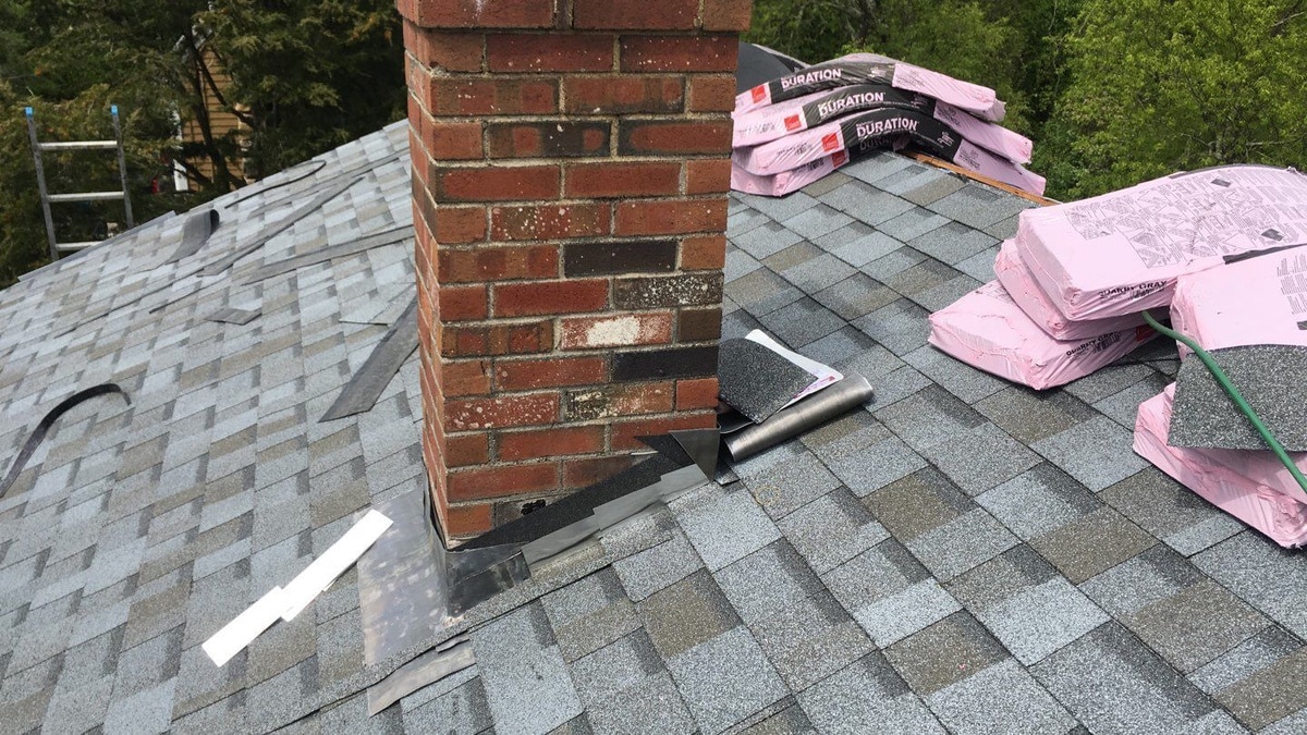 New Owens Corning Duration Quarry Gray roof and brick chimney, South Kingstown