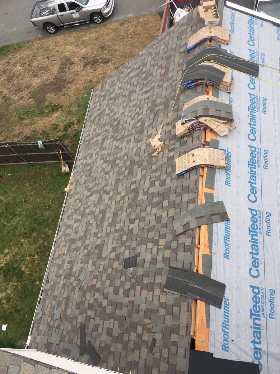 Ridge cap installation on Bristol RI Landmark PRO roof