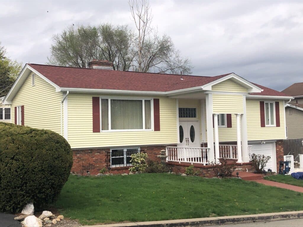 Residential roof replacement in North Providence, RI, featuring a new red asphalt shingle roof
