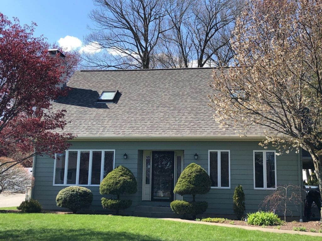 Residential roof replacement in Johnston, RI, featuring asphalt shingles.