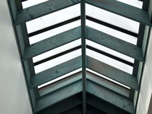 Interior view of wood-framed skylights in Little Compton, RI, providing natural light.