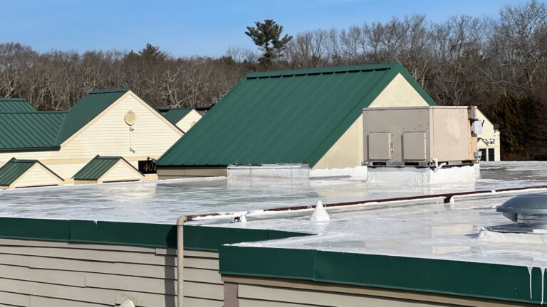 Commercial building with silicone roof coating in Exeter, RI by Pinnacle Roofing & Skylights, Exeter's trusted, local roofing company.