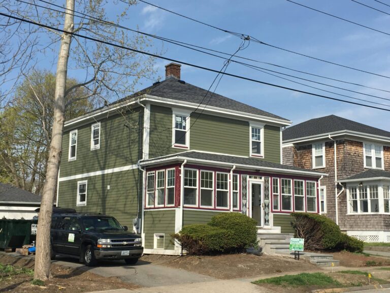 Two-story home in Newport RI with James Hardie siding by Pinnacle. Pinnacle Roofing & Skylights, Newport’s trusted, local roofers.
