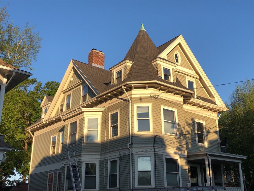 Providence RI home with new roof, featuring asphalt shingles. Historical roof replacement.