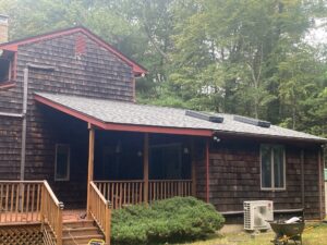 Richmond, RI home with new Velux skylights installed on an asphalt shingle roof by Pinnacle Roofing & Skylights.