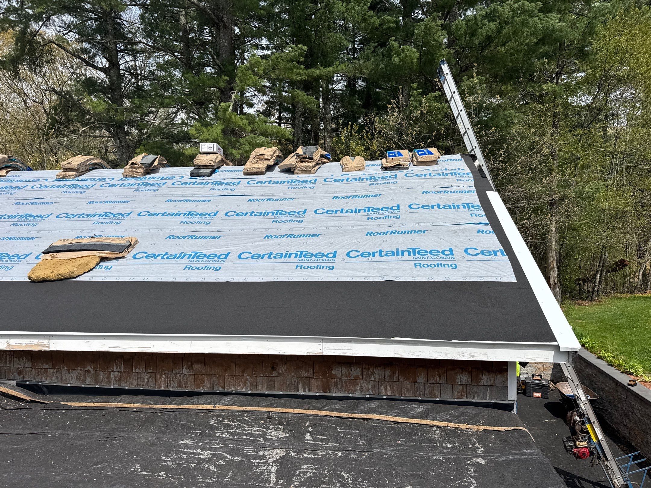 New synthetic underlayment on Coventry storm roof tear-off