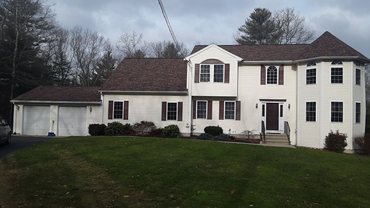 Storm-damaged roof restored in West Greenwich, Burnt Sienna color