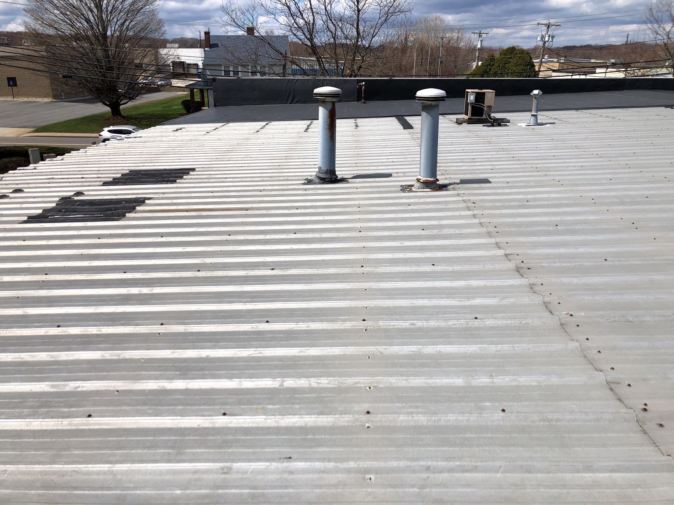 After — Cranston, RI Commercial Roof Repair — Metal Roof Flashing and Penetration Sealing