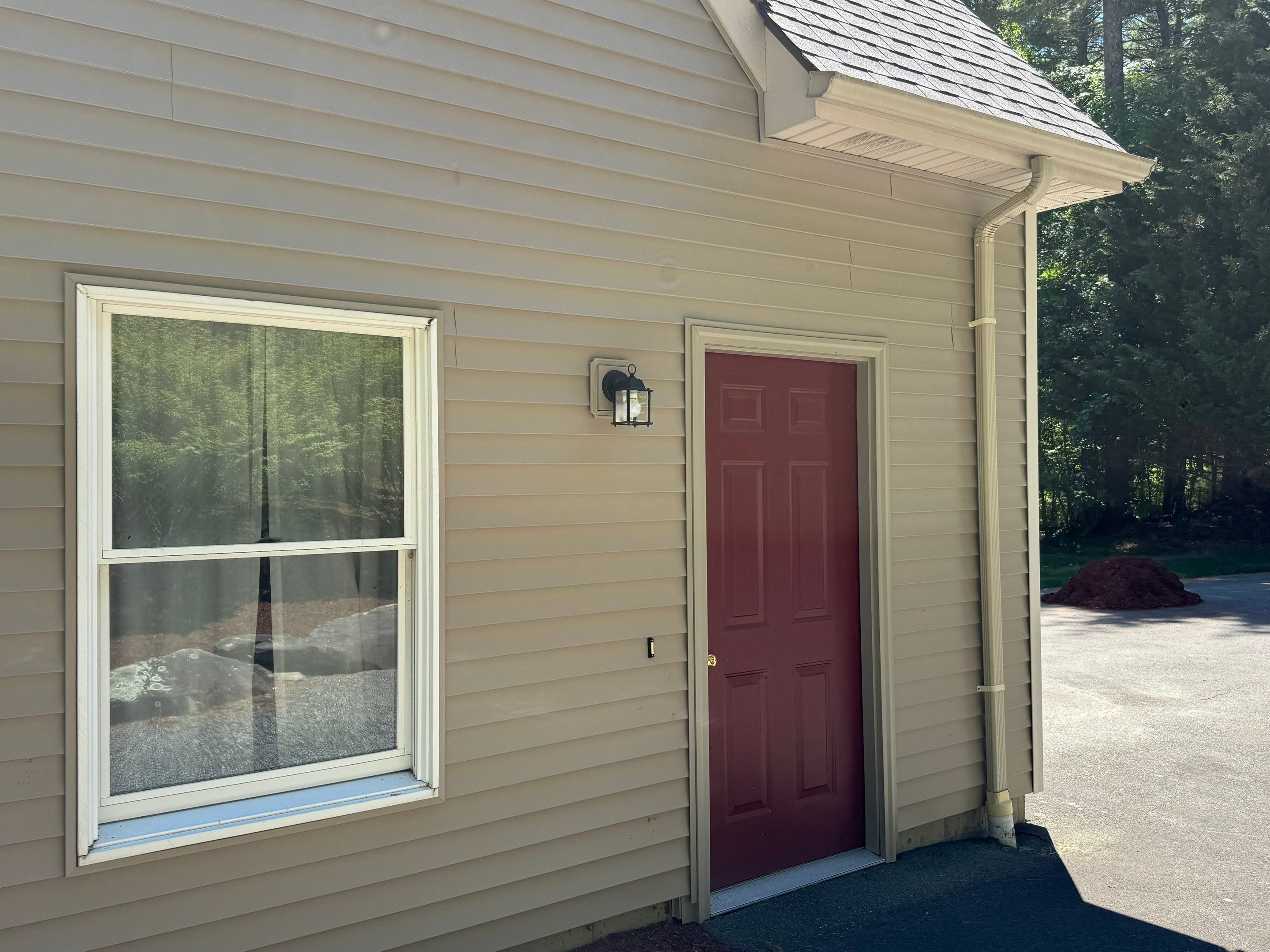 Scituate new siding and trim around side entry door