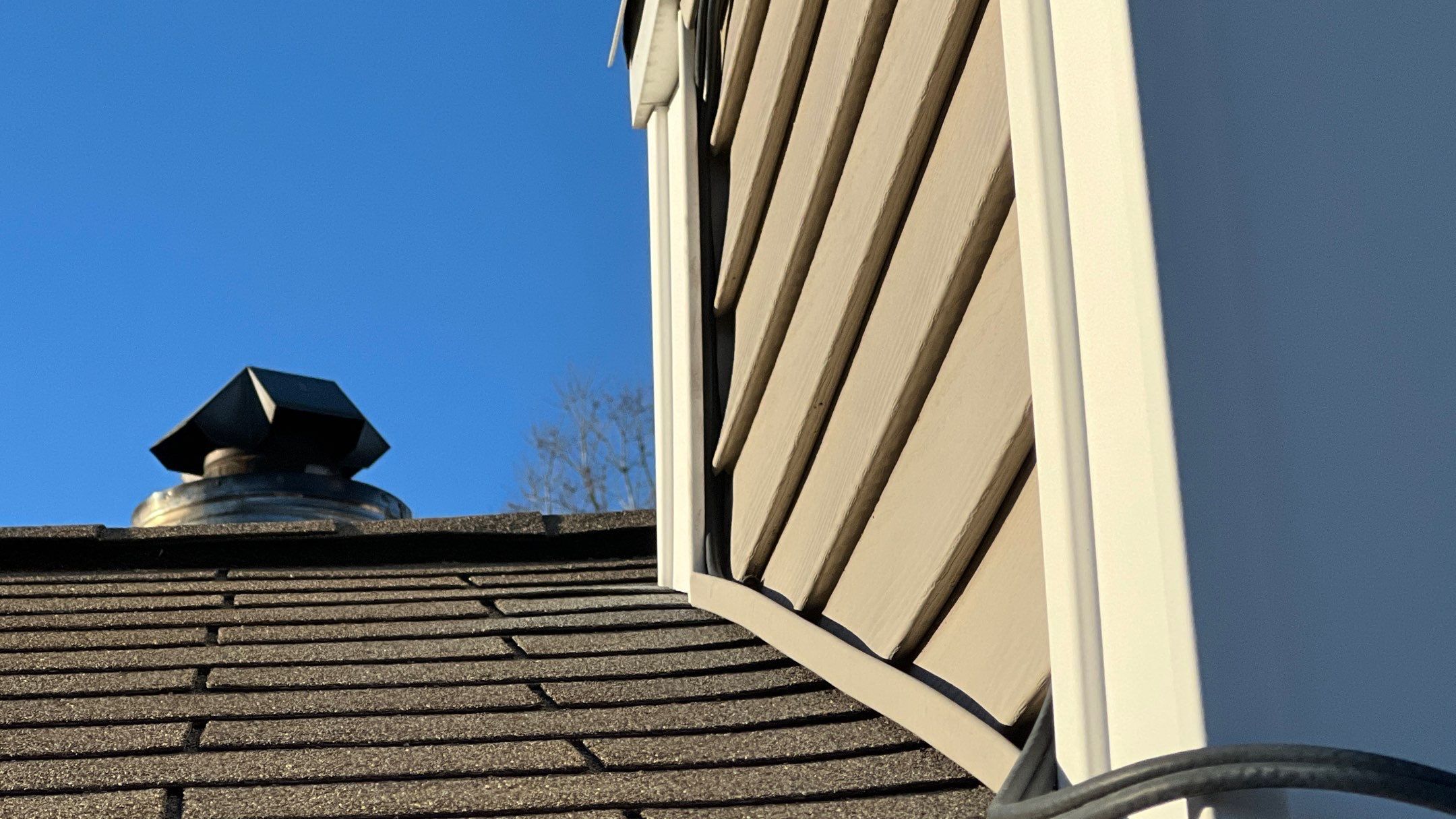 Charlestown siding repair, fresh exterior with roof vent detail