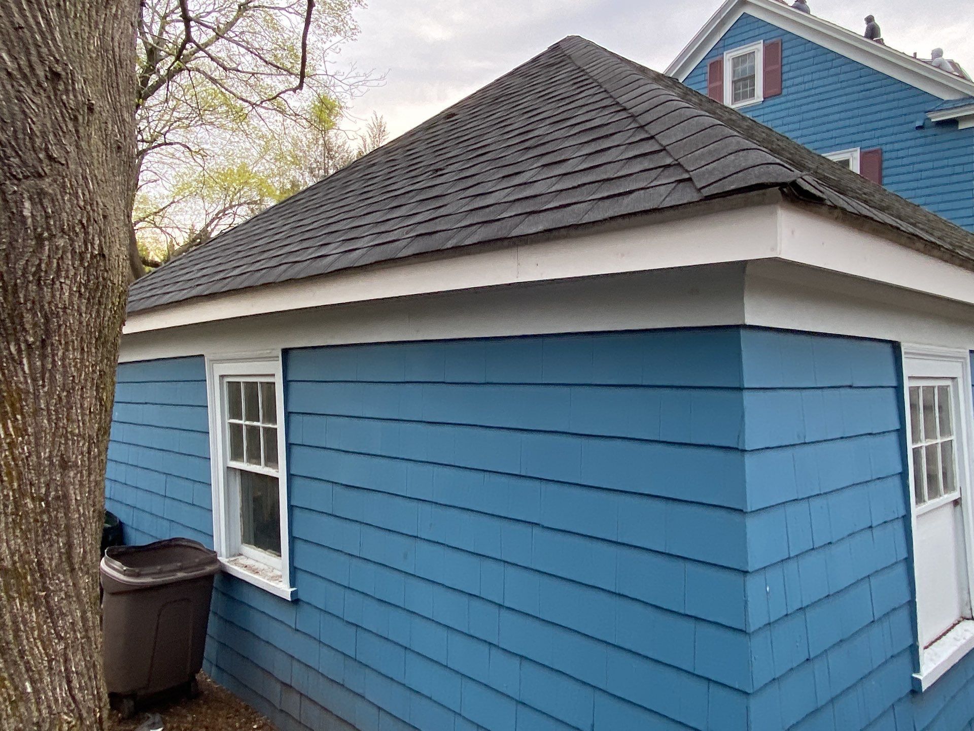 Detached garage with new hip roof, Providence roof repair
