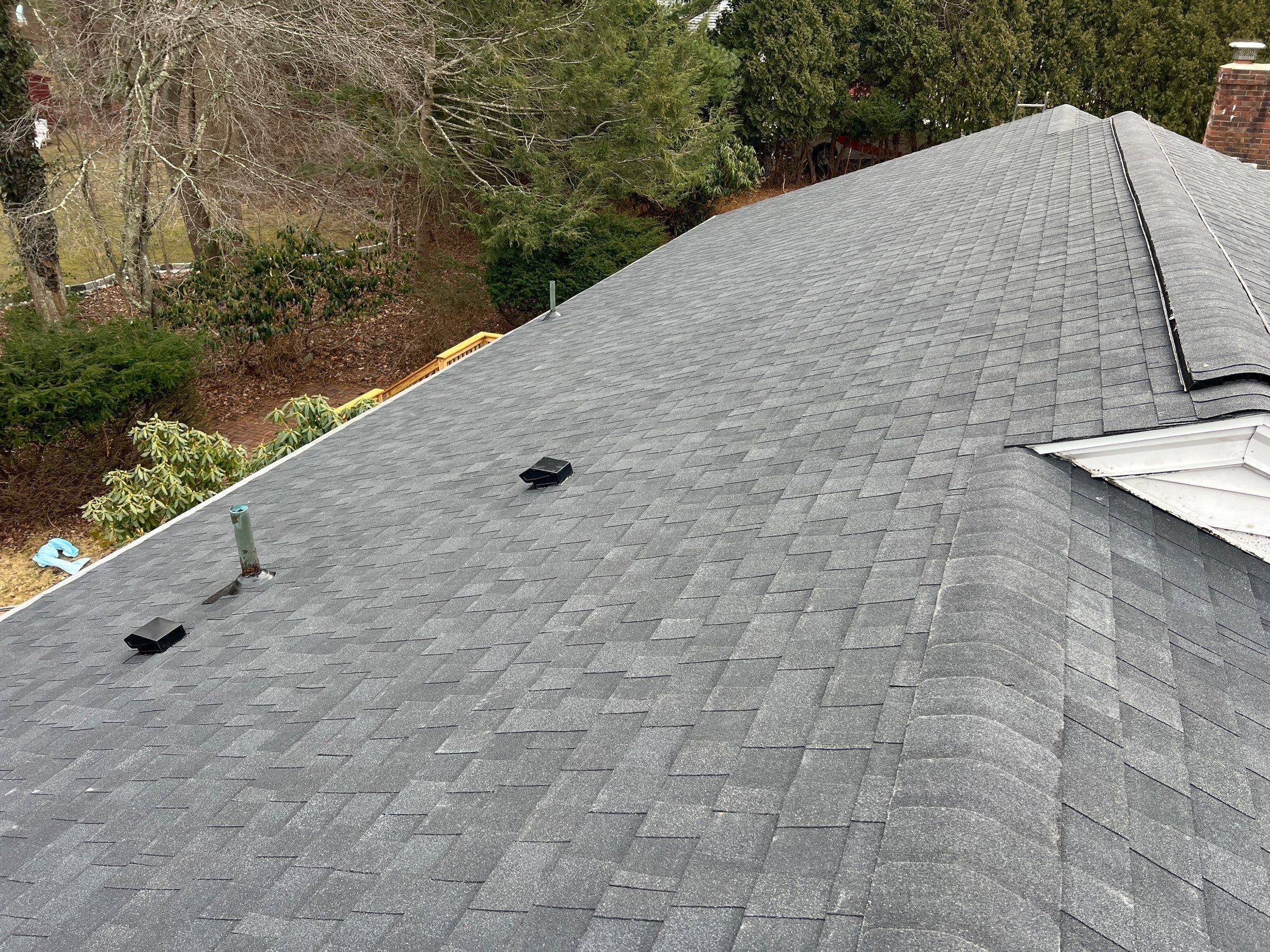 aerial of new shingle roof with chimney, lincoln residential roofing