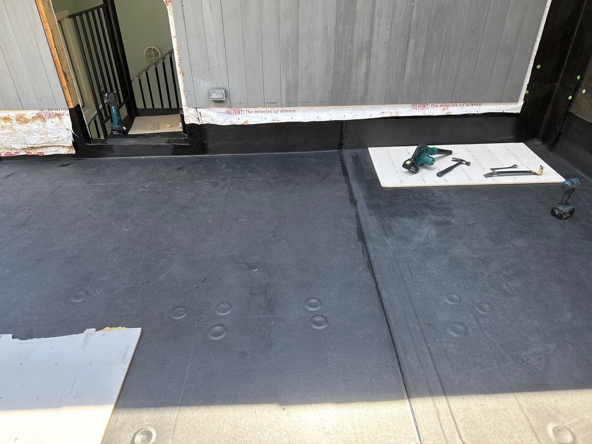 After — Burrillville Commercial Roofing — Fully-Adhered EPDM Membrane Over a Low-Slope Rear Deck