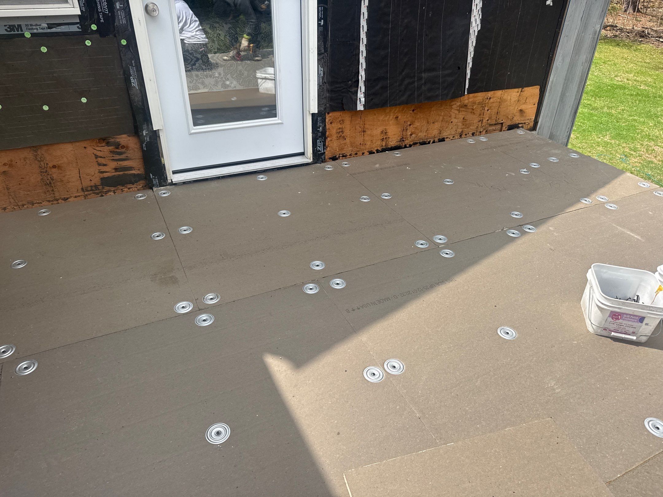 Fastened cover board during flat-roof install, Burrillville