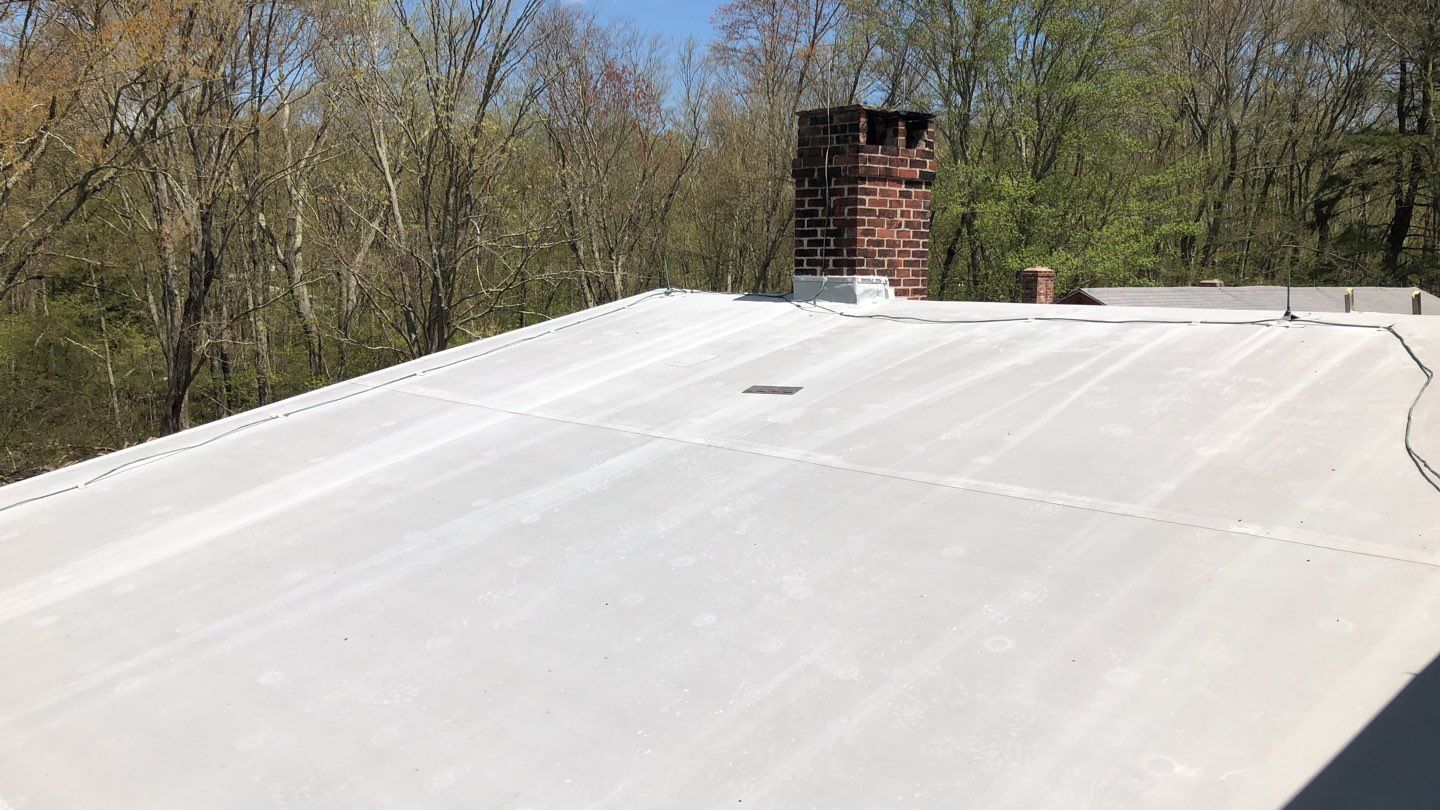 flat membrane roof and chimney