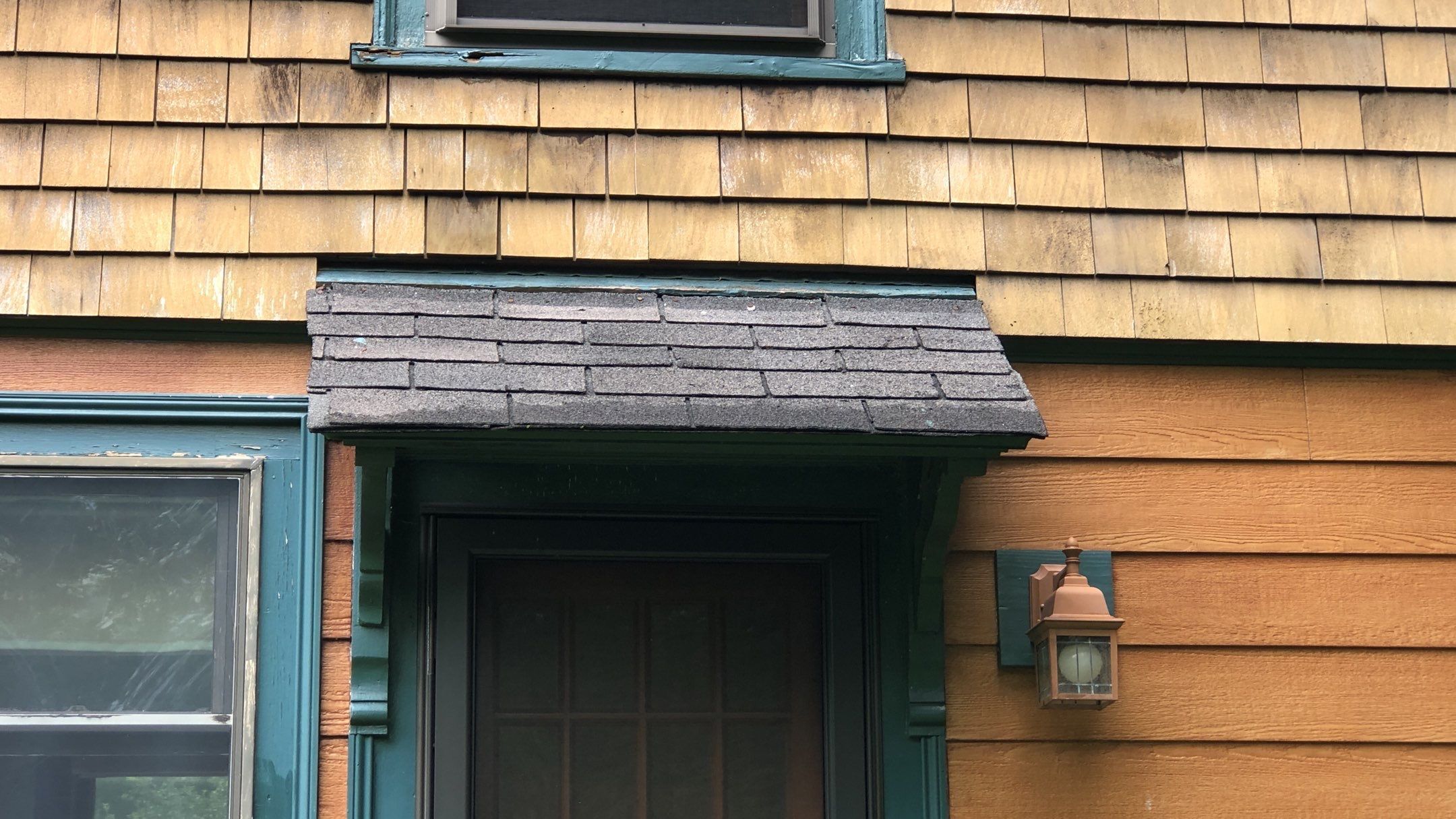 new cedar shake siding at entry