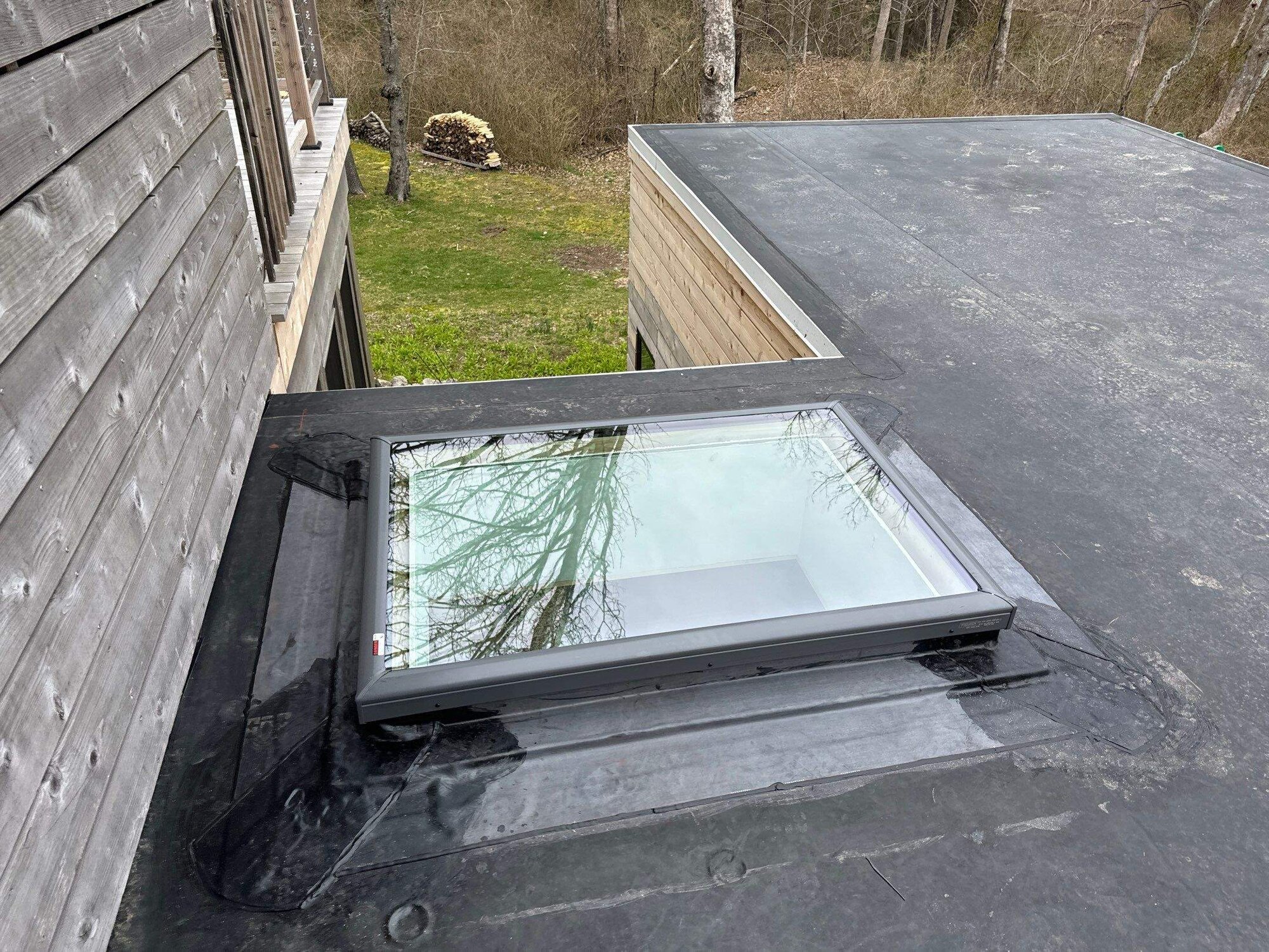 Deck-mounted skylight set into the finished roof