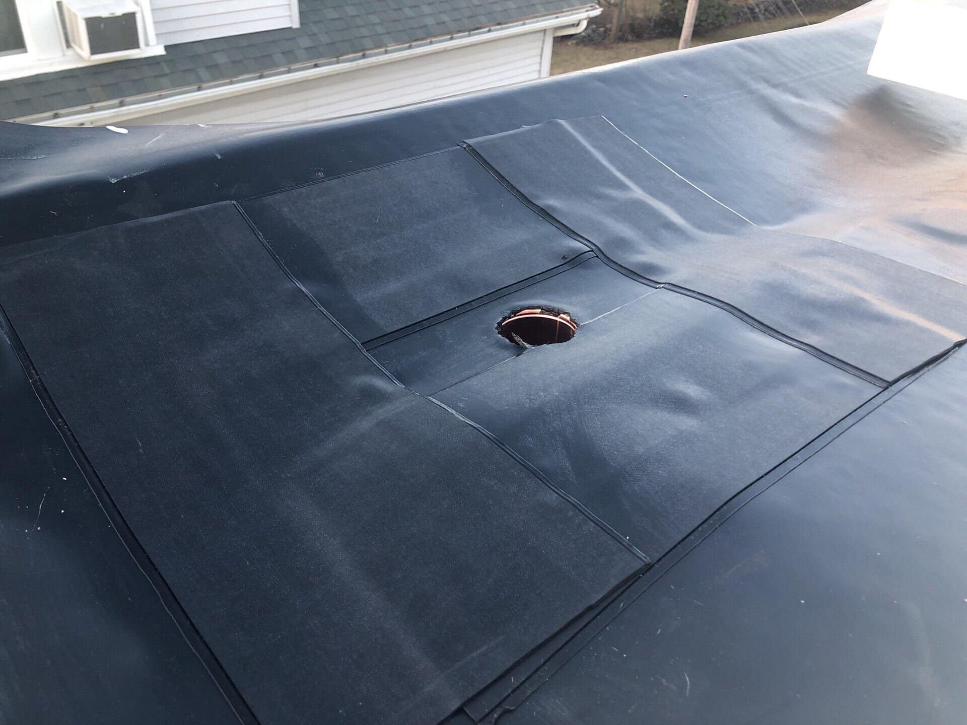 Cumberland, RI Commercial Roofing — EPDM Rubber Membrane on a Low-Slope Roof