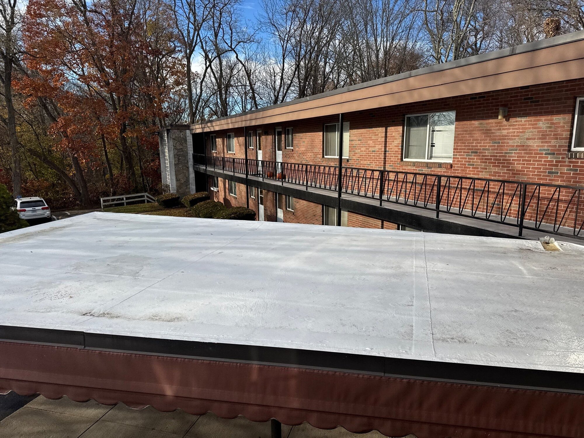 Warwick, RI Commercial Roofing: Seamless Silicone Coating on a Multi-Unit Flat Roof