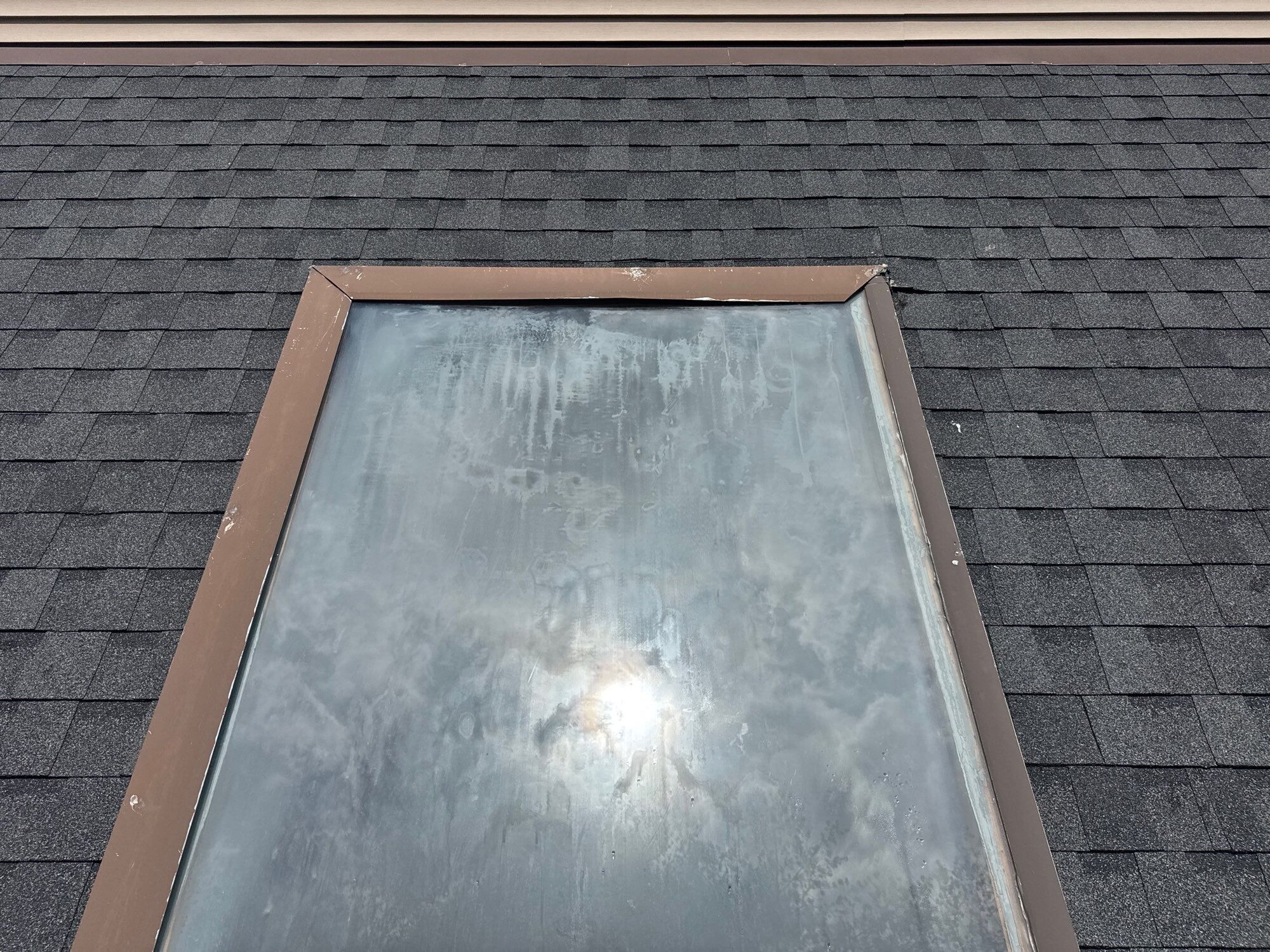Clean skylight flashing detail on the completed roof
