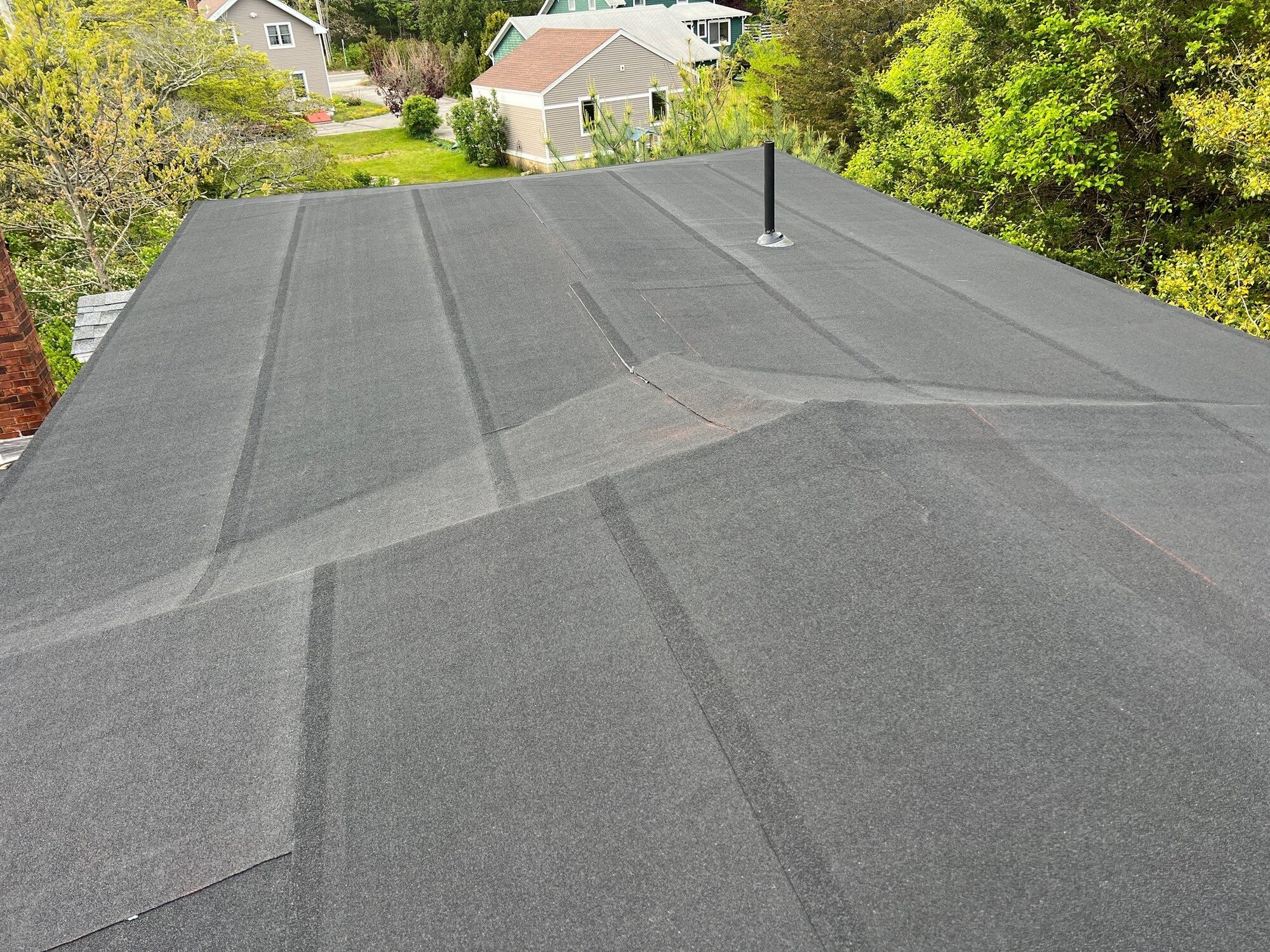 After — Charlestown, RI Commercial Roofing: Torch-Down Flat Roof on a Multi-Unit Mansard Building