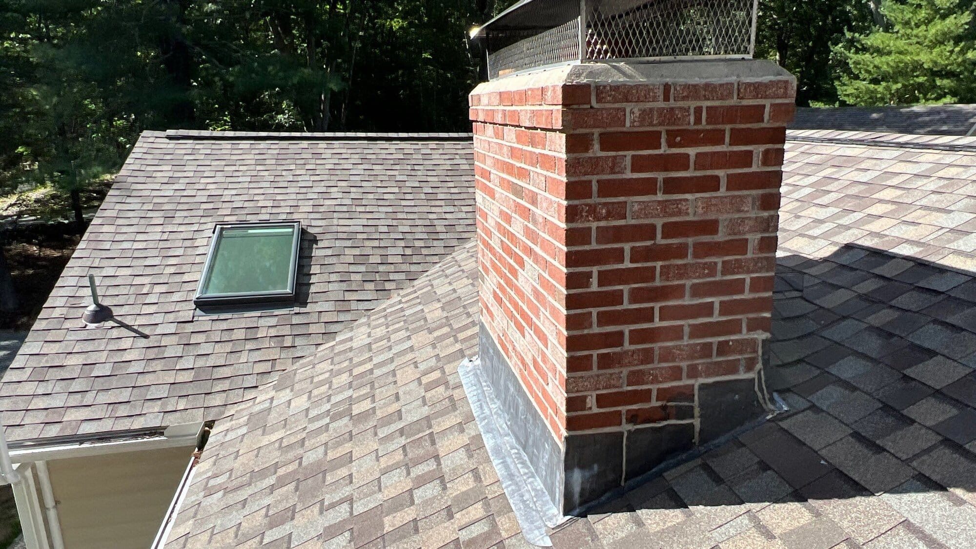 After — East Greenwich, RI Roof Repair — Brick Chimney Rebuild and New Step-Flashing