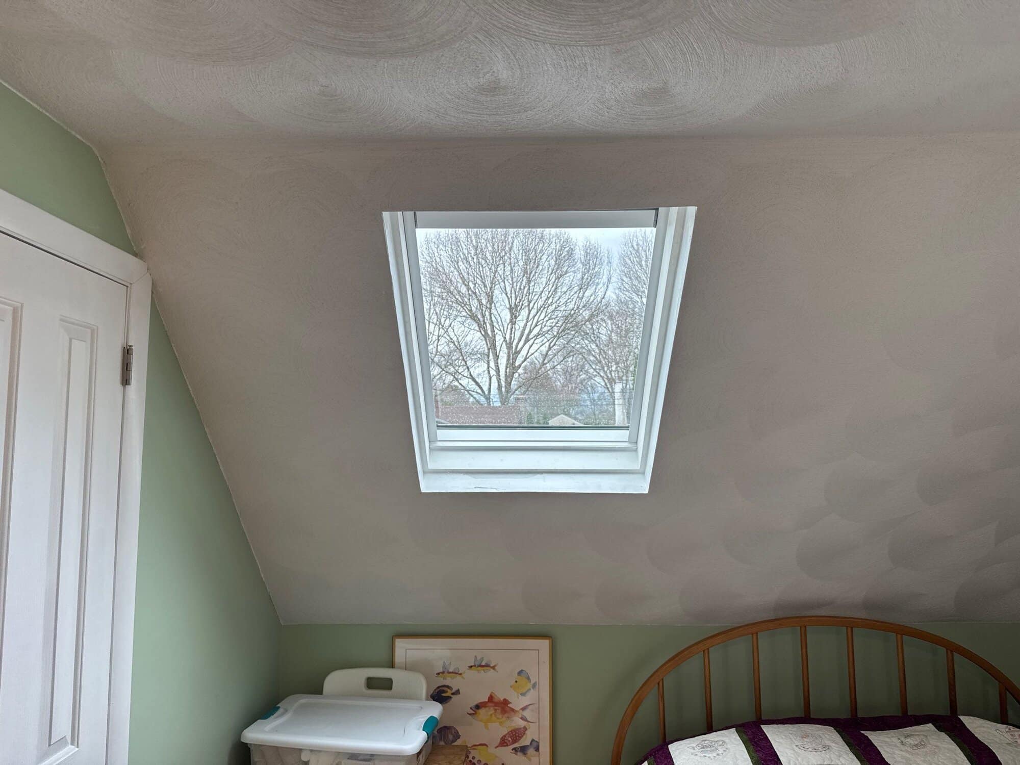 Clean skylight flashing detail on the completed roof