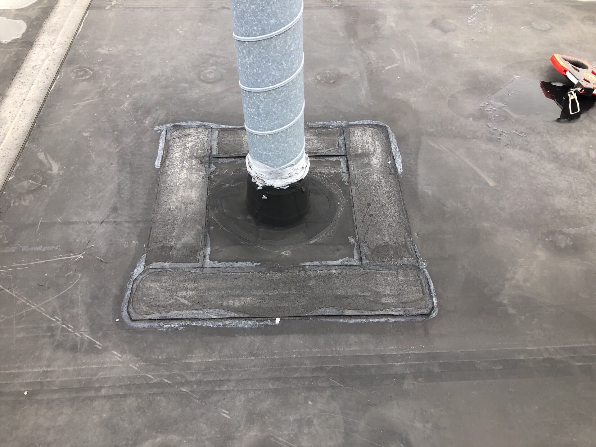 Clean seam and flashing detail on the flat roof