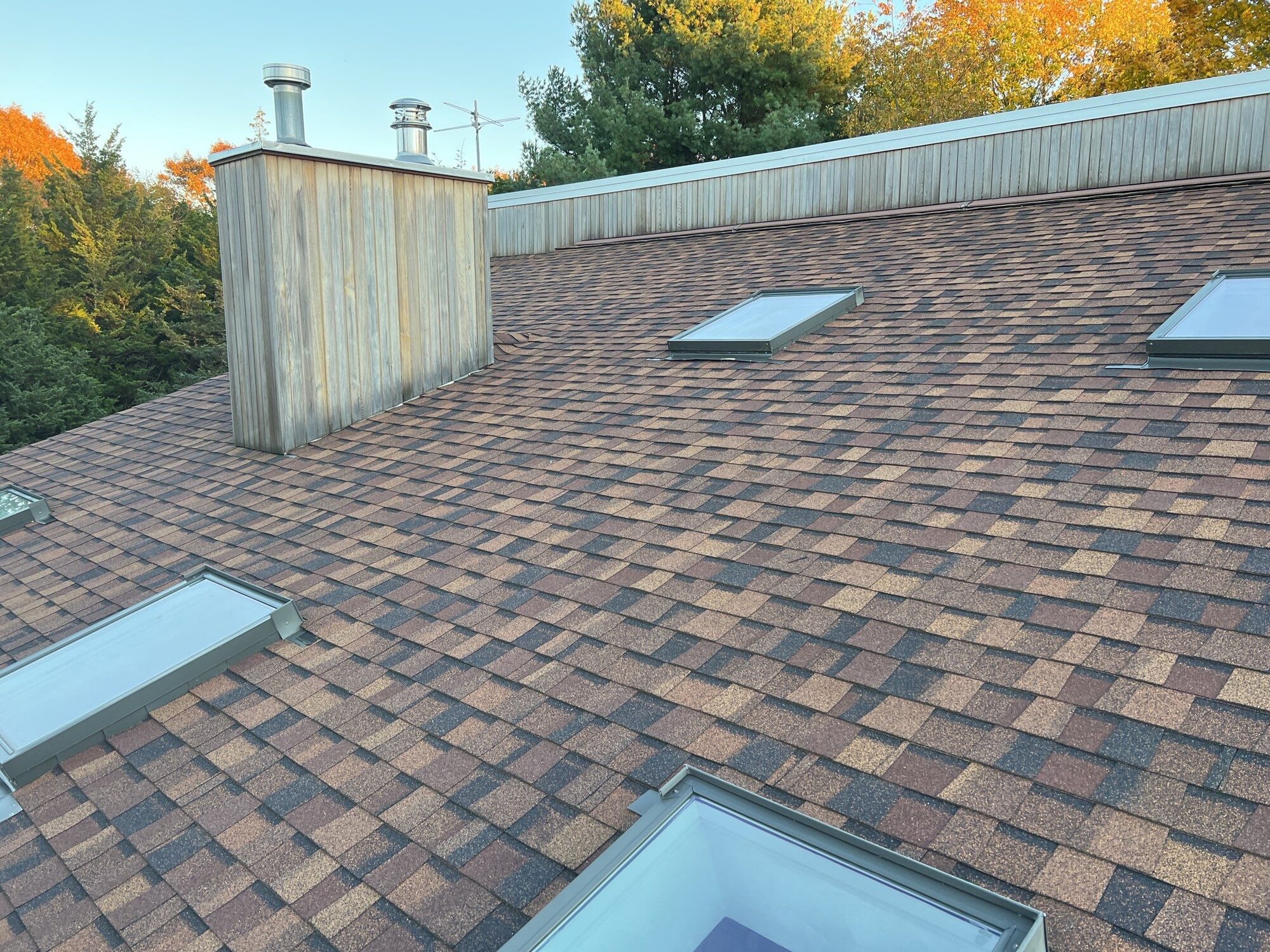 After — Charlestown, RI Skylights: Multiple Deck-Mounted Skylights in a New Architectural-Shingle Roof