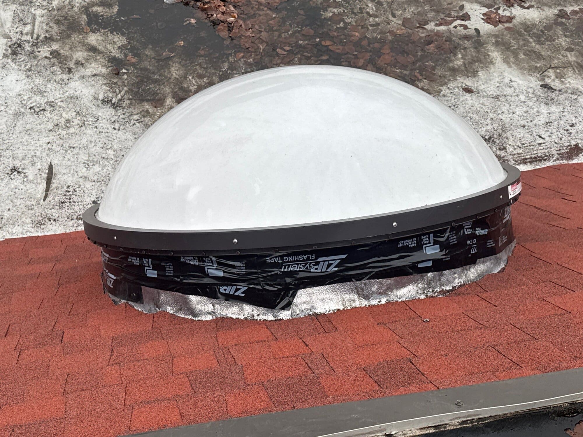 After — East Providence, RI Skylights: A Freshly Flashed Dome Skylight on a Large Multi-Gable Home