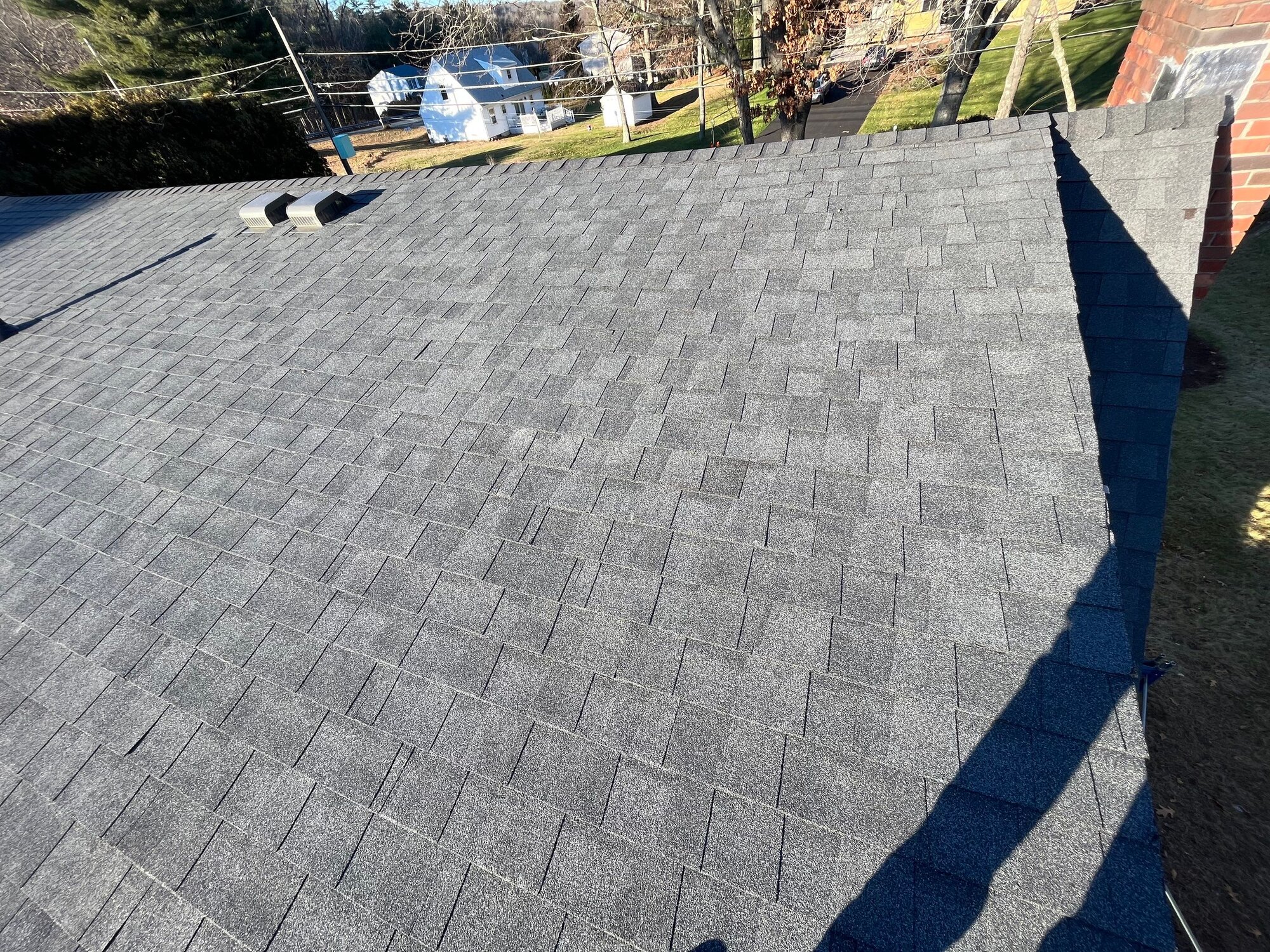 Continuous ridge vent runs the length of the finished roof peak