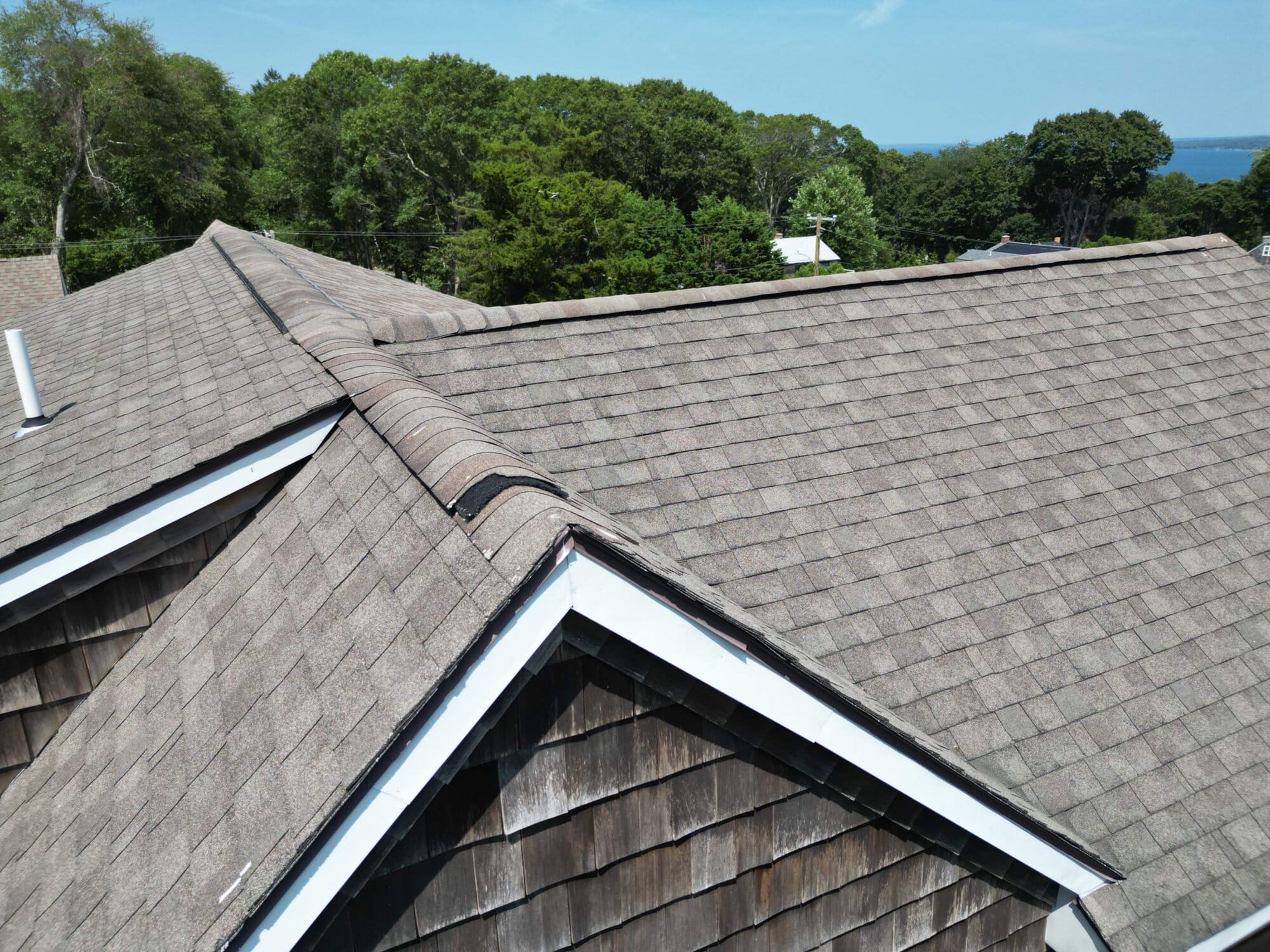 After — Saunderstown, RI Roof Replacement: A Waterfront Gambrel-Cape Vented to Protect Shingle Lifespan