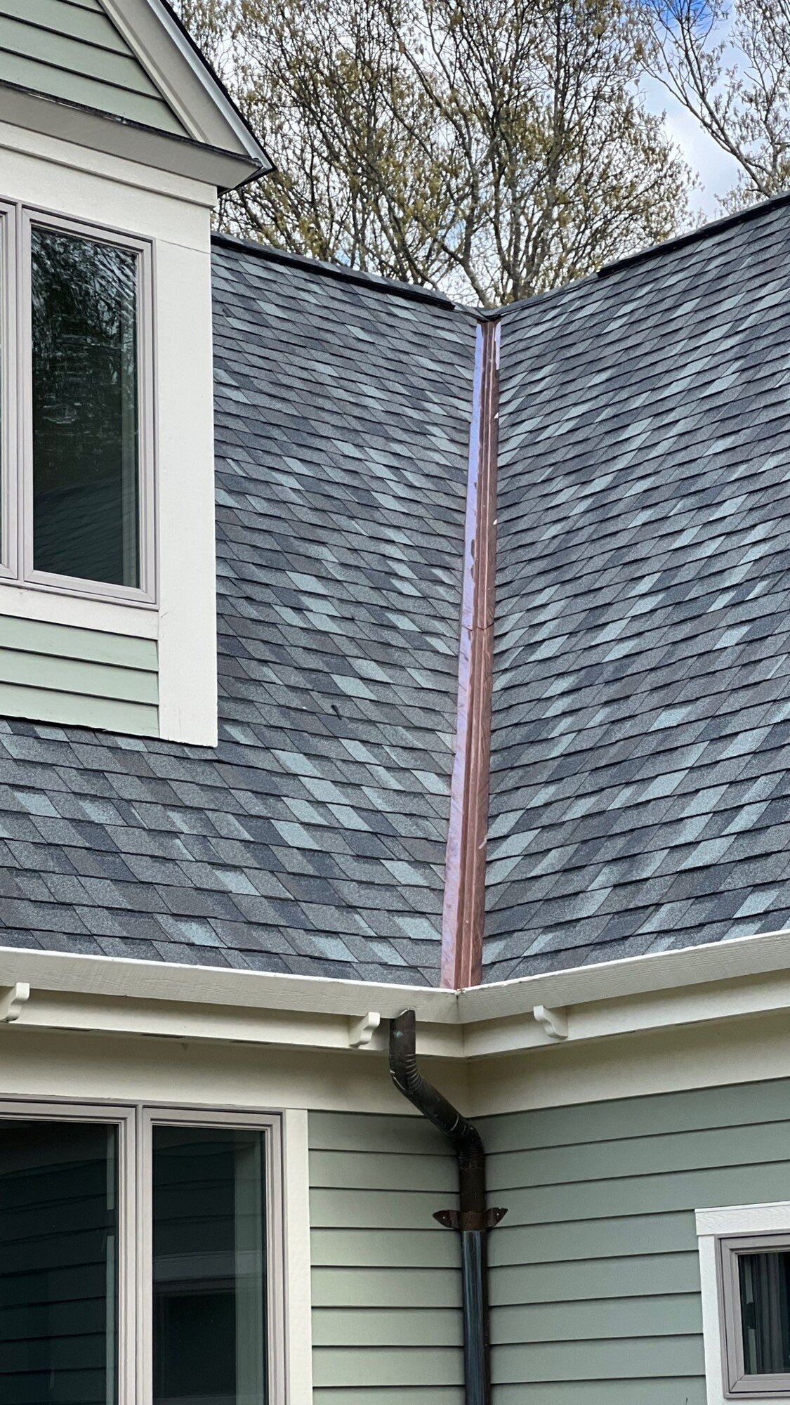 After — New Seamless Gutters on a Sage-Green Cape in North Kingstown, RI
