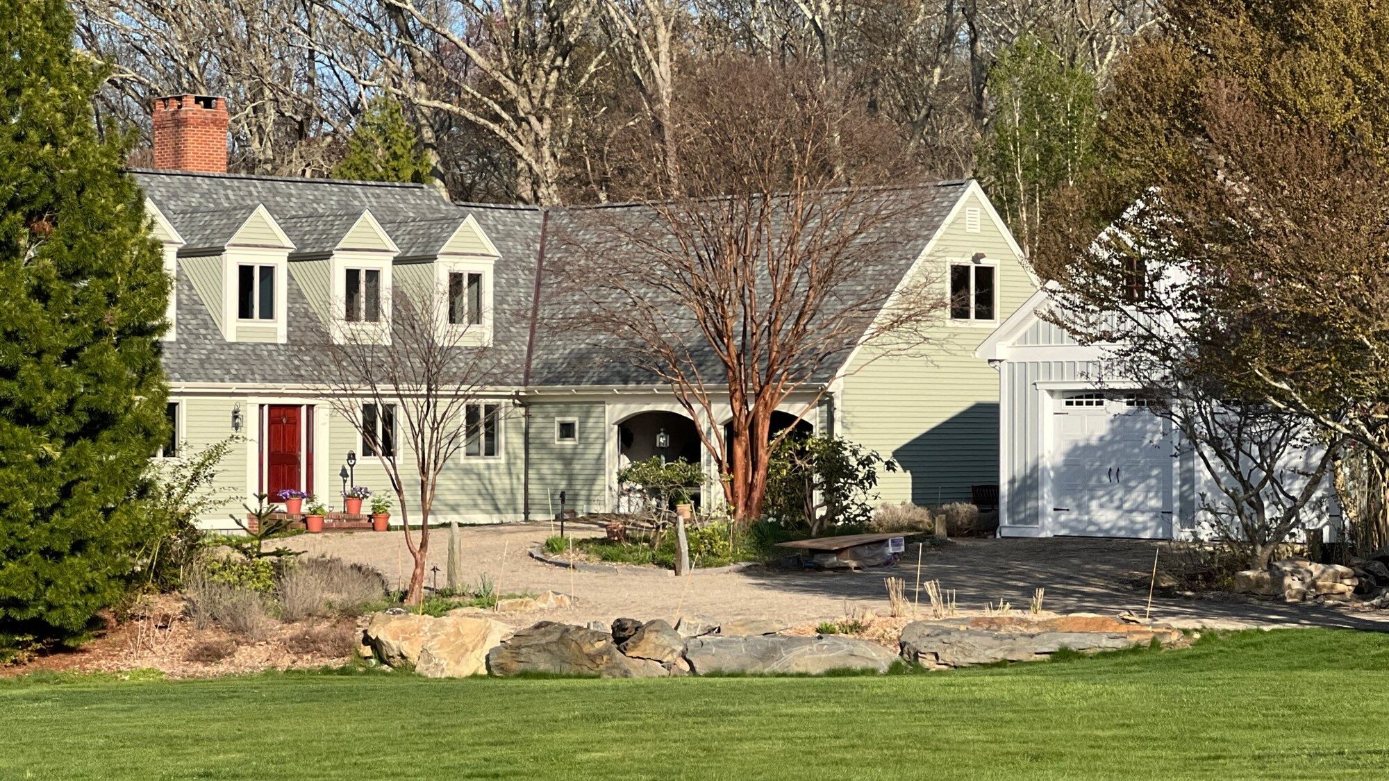 New Seamless Gutters on a Sage-Green Cape in North Kingstown, RI