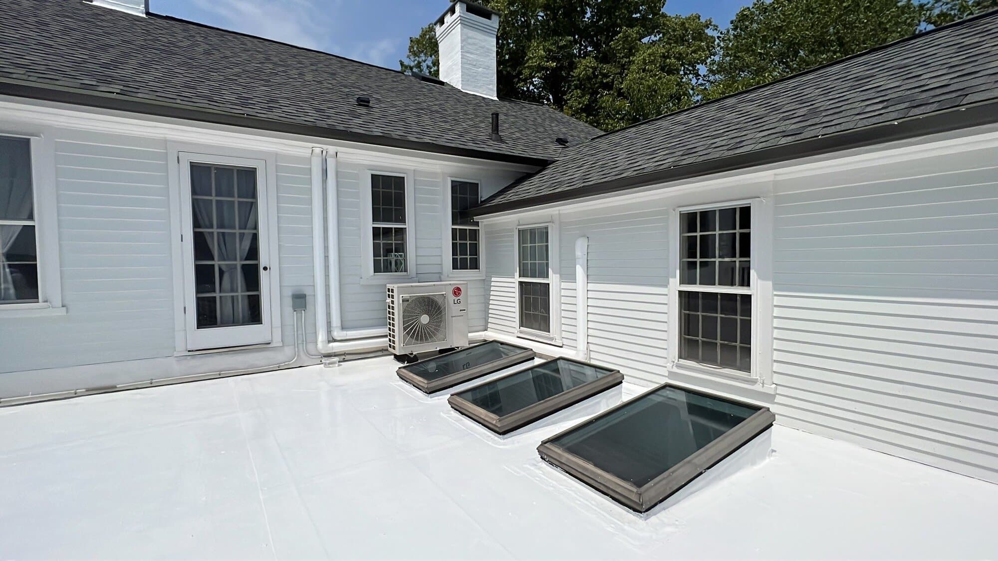 After — Deck-Mounted Skylights in North Kingstown, RI — Granite Gray Colonial