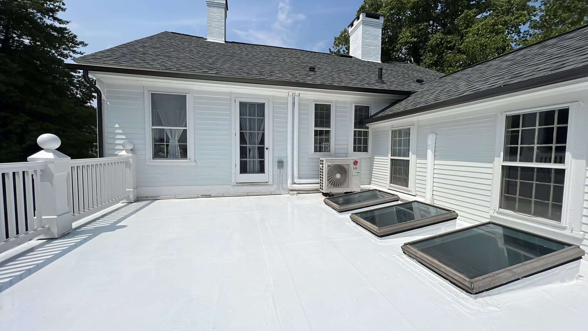 Deck-mounted skylight with clean flashing