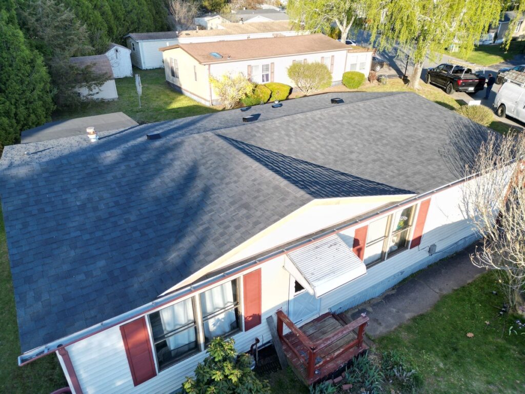 CertainTeed Landmark Charcoal Black roof replacement completed in Coventry RI - aerial drone view by Pinnacle Roofing