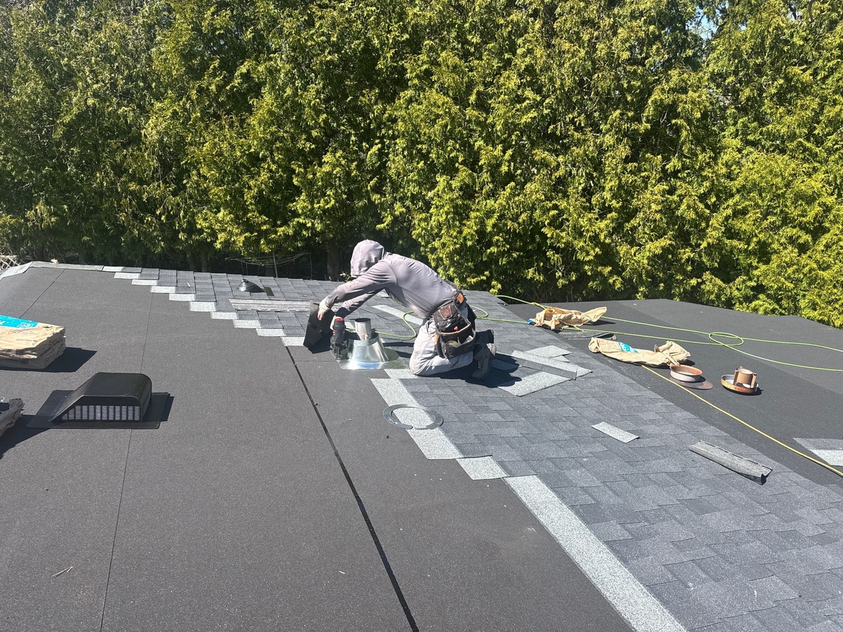 Pinnacle Roofing crew installing CertainTeed Landmark Charcoal Black shingles in Coventry RI